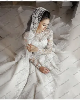 Eleganta, Balta Mežģīņu Kāzu Kleitas Redzēt Ar Garām Piedurknēm Ziedi, Līgavas Kāzu Tērpi, Jo Spīguļi, Dubaija Elsojošs Bumbu Kleita