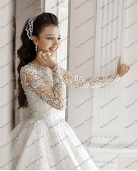 Eleganta, Balta Mežģīņu Kāzu Kleitas Redzēt Ar Garām Piedurknēm Ziedi, Līgavas Kāzu Tērpi, Jo Spīguļi, Dubaija Elsojošs Bumbu Kleita